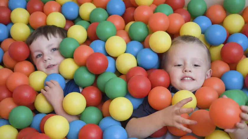 Boys playing in the ball pit at an early start nursery, ran by the Nottingham Royal Society for the Blind (NRSB).