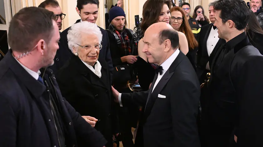 Holocaust survivor and Italian Senator for Life, Liliana Segre (L) , is welcomed by Teatro alla Scala superintendent Dominique Meyer upon her arrival for the La Scala opera house's season opener to attend Giuseppe Verdi's "La forza del destino", in Milan, Italy, 07 December 2024. The Scala opera house season opener is considered one of the highlights of the European cultural calendar. ANSA/DANIEL DAL ZENNARO