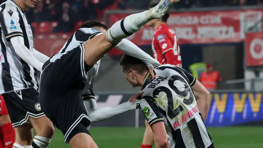 Udinese's forward Lorenzo Lucca fet Udinese's defender Jaka Bijol after scoring goal during the Italian Serie A soccer match between AC Monza and Udinese at U-Power Stadium in Monza, Italy, 9 December 2024. ANSA / ROBERTO BREGANI