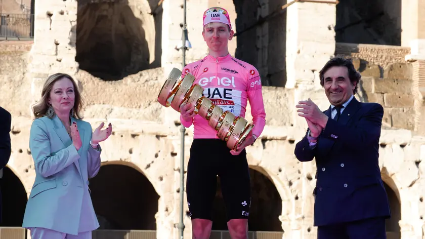 Italy's Prime Minister Giorgia Meloni, Slovenian rider Tadej Pogacar of Uae Team Emirates and Urbano Cairo celebrates with the trophy after winning of the Giro d'Italia 2024 cycling tour, in Rome, Italy, 25 May 2024