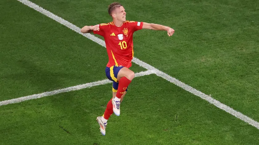epa11469393 Dani Olmo of Spain celebrates after the 2-1 goal during the UEFA EURO 2024 semi-finals soccer match between Spain and France in Munich, Germany, 09 July 2024. EPA/ABEDIN TAHERKENAREH