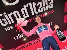 British rider Geraint Thomas of Team Ineos Grenadiers wearing the overall leader's pink jersey celebrates on the podium retaining the overall leader's pink jersey after the fourteenth stage of the 2023 Giro d'Italia cycling race over 193 km from Sierre to Cassano Magnago, Swiss, 20 May 2023. ANSA/LUCA ZENNARO