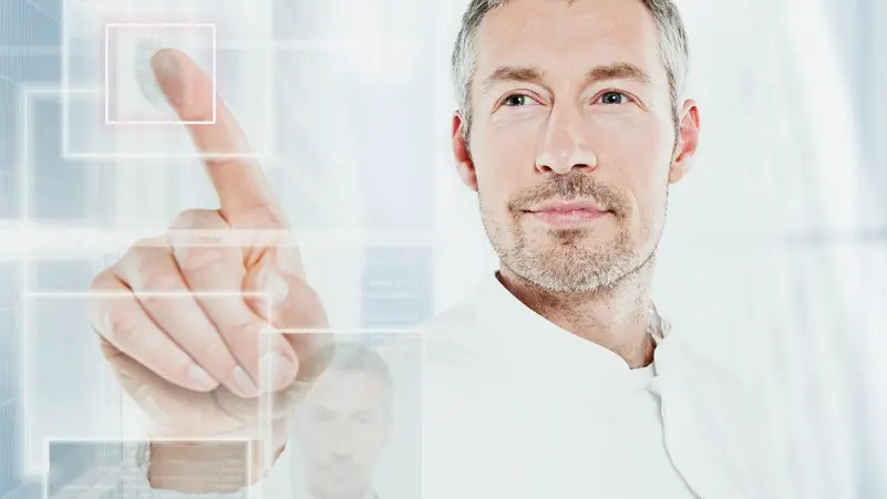 Man using a touchscreen --- Image by © Oliver Eltinger/Corbis