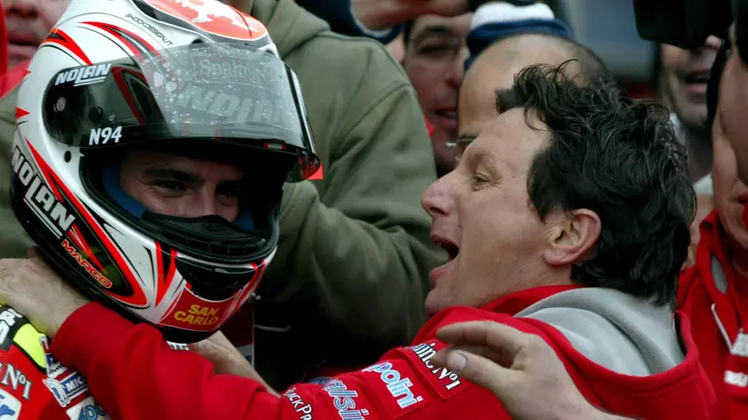 Italian Moto GP rider Marco Melandri (L) of team Fortuna Honda celebrates his win with team manager Fausto Gresini after the Moto GP at Istanbul Park Circuit near of Istanbul, Turkey on Sunday; 30 April 2006. ANSA / TOLGA BOZOGLU / PAL