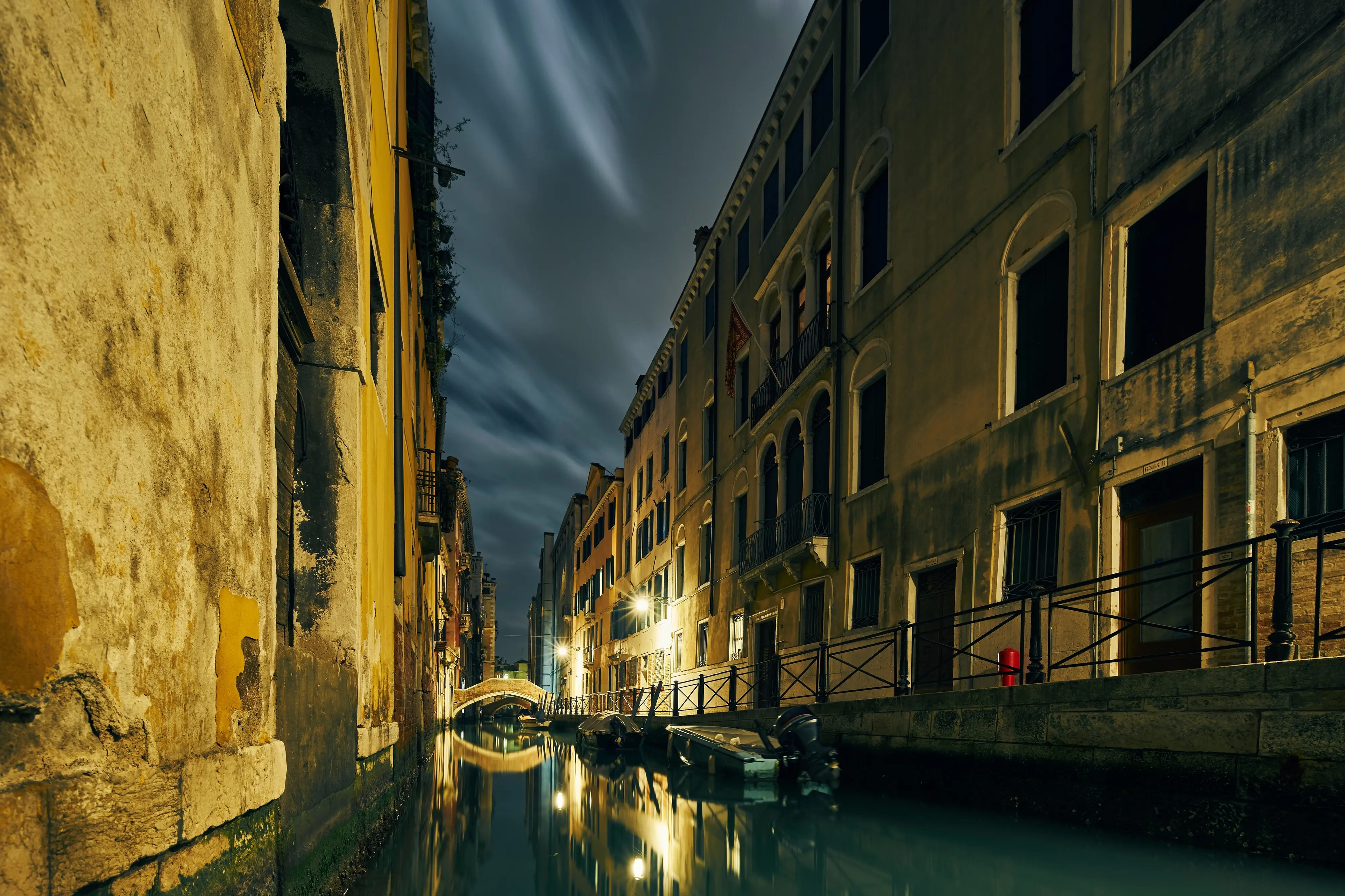 Canal and traditional waterfront houses at night, Venice, Italy