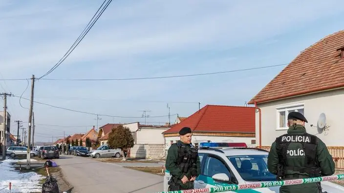 epa06566813 Police officers secure the crime site where Slovak journalist Jan Kuciak was found shot dead together with his girlfriend Martina in Velka Maca near Bratislava, Slovakia, 26 February 2018. The 27-year-old reporter was working for the Slovak news website actuality.sk and specializing on topics of tax evasion. Police suspect that the killing is linked to his investigations. EPA/MICHAL SMRCOK