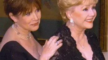 epa05690410 A handout photo made available by the Las Vegas News Bureau on 28 December 2016 shows US actresses Debbie Reynolds (R) and daughter Carrie Fisher (L) arriving at The Ritz-Carlton Lake Las Vegas in Henderson, Nevada, USA, 27 February 2007 to celebrate Elizabeth Taylor's 75th. Carrie Fisher died at age 60 in Los Angeles on 27 December 2016. According to media reports on 28 December 2016, Debbie Reynolds has been hospitalized due to a possible stroke. EPA/BRIAN JONES / HANDOUT HANDOUT Mandatory credit: LVNB/Brian Jones via european pressphoto agency HANDOUT EDITORIAL USE ONLY/NO SALES