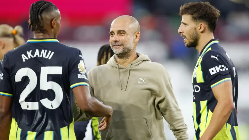 epa11576275 Manchester City manager Pep Guardiola celebrates with Manuel Akanji after the English Premier League soccer match of West Ham United against Manchester City, in London, Britain, 31 August 2024. EPA/DAVID CLIFF EDITORIAL USE ONLY. No use with unauthorized audio, video, data, fixture lists, club/league logos, 'live' services or NFTs. Online in-match use limited to 120 images, no video emulation. No use in betting, games or single club/league/player publications.