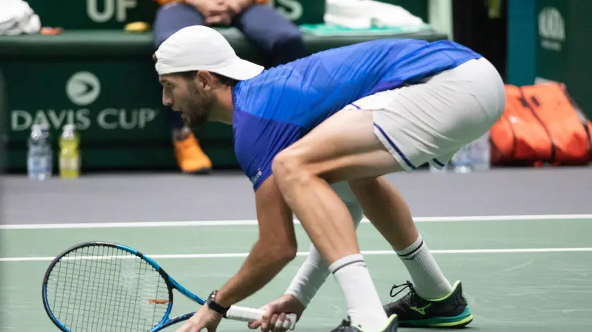 epa11606567 Andrea Vavassori (pictured) and Simone Bolelli of Italy play against Wesley Koolhof and Botic van de Zandschulp of the Netherlands during the Davis Cup Finals Group A match between Italy and the Netherlands in Bologna, Italy, 15 September 2024. EPA/MAX CAVALLARI