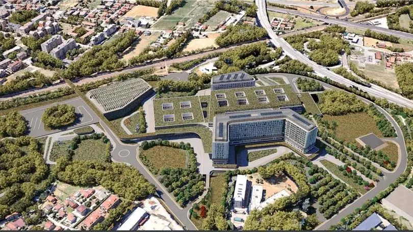 Un rendering del progetto del nuovo ospedale a San Lazzaro: al centro a sinistra l’area in cui dovrebbe sorgere il capolinea del tram