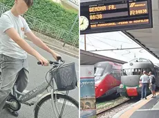 Lorenzo con la sua vecchia bicicletta, rubata; a destra, la stazione di Gemona