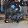 Un manifestante immobilizzato dalla polizia durante gli scontri a Udine (foto Petrussi)