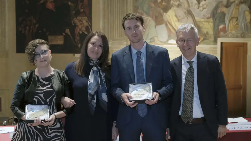 L'avvocato Rubini tra i premiati Monica Molinaro e Filippo Apolloni con Francesco Rossi