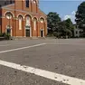 Il piazzale della chiesa e le macchie di sangue lasciate dal ferito dopo l’aggressione (foto Zangirolami)