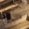 Un frame del video della rissa tra rider in piazza De Gasperi