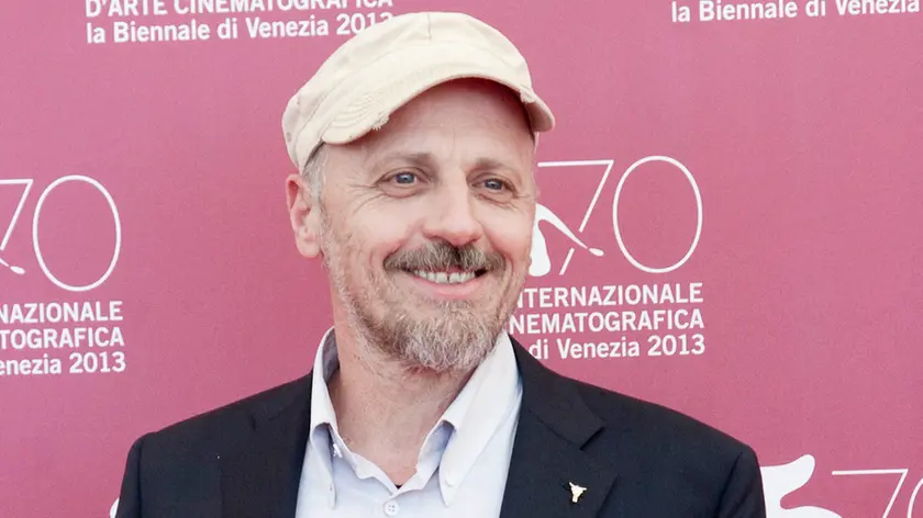 06 Sep 2013, Venice, Italy --- 70th Venice International Film Festival the cast of the film La Prima Neve pose for photographers during the photocall. Pictured: Marco Paolini --- Image by © Riccardo Cesari/Splash News/Corbis