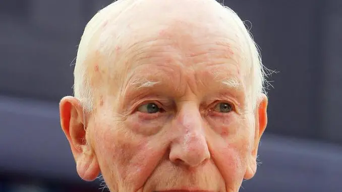 epa05841020 (FILE) - Former British Formula One driver John Surtees walks through the paddock before the 2015 Formula One Grand Prix of Great Britain at Silverstone race track, Northamptonshire, Britain, 05 July 2015. Surtess died at the age of 83 on 10 March 2017 his family announced in a statement. EPA/GEOFF CADDICK