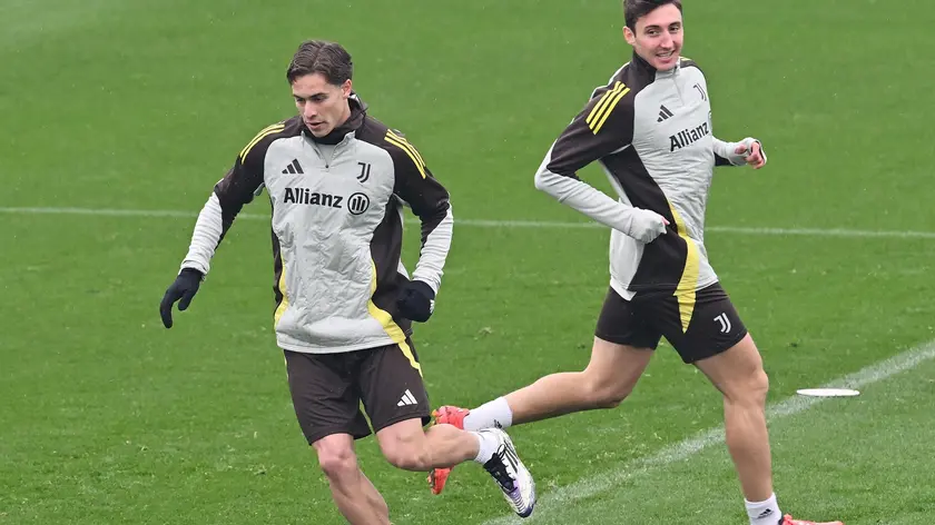 epa11767999 Juventus players Kenan Yildiz (L) and Andrea Cambiaso in action during a training session of the team in Turin, Italy, 10 December 2024. Juventus will face Manchester City in the UEFA Champions League on 11 December. EPA/ALESSANDRO DI MARCO