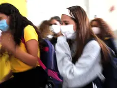 Students are waiting to enter the school in Codogno, Italy, 14 September 2020. Codogno, the municipality in the province of Lodi, was the first in Italy to be declared a "red zone" due to the Coronavirus Covid19 pandemic ANSA / MATTEO BAZZI