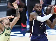 epa11480327 LeBron James (R) of the USA and Jack McVeigh of Australia in action during the 2024 USA Basketball Showcase game between USA and Australia in Abu Dhabi, United Arab Emirates, 15 July 2024. EPA/ALI HAIDER