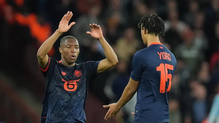 epa11273851 Lille's Bafode Diakite (L), assisted by his colleague Lille's Leny Yoro (R), celebrates after scoring for the 2-1 against Aston Villa during the UEFA Europa Conference League quarter-finals, 1st leg soccer match between Aston Villa and OSC Lille in Birmingham, Britain, 11 April 2024. EPA/TIM KEETON