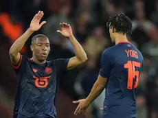 epa11273851 Lille's Bafode Diakite (L), assisted by his colleague Lille's Leny Yoro (R), celebrates after scoring for the 2-1 against Aston Villa during the UEFA Europa Conference League quarter-finals, 1st leg soccer match between Aston Villa and OSC Lille in Birmingham, Britain, 11 April 2024. EPA/TIM KEETON