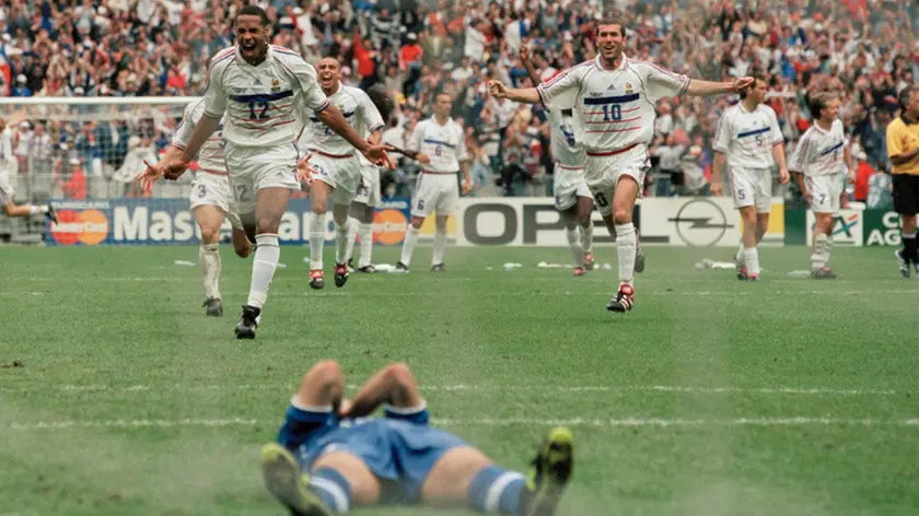 03 Jul 1998, France --- French players celebrate after Italy's Luigi Di Biagio misses his penalty shot, during the 1998 soccer World Cup quarter-final match against Italy. | Location: St.-Denis, France. --- Image by © Dimitri Iundt/TempSport/Corbis