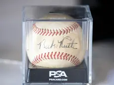 epa10028767 A Babe Ruth signed baseball is displayed, and will be auctioned during the Sports Legends Auction at Julien's Auctions in Beverly Hills, California, USA, 22 June 2022. The auction will take place on 28 June 2022. EPA/ETIENNE LAURENT