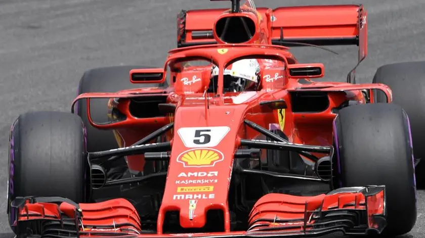 Ferrari driver Sebastian Vettel of Germany steers his car during the qualifying session at the Hockenheimring racetrack in Hockenheim, Germany, Saturday, July 21, 2018. The German Formula One Grand Prix will be held on Sunday, July 22, 2018. (ANSA/AP Photo/Jens Meyer) [CopyrightNotice: Copyright 2018 The Associated Press. All rights reserved.]