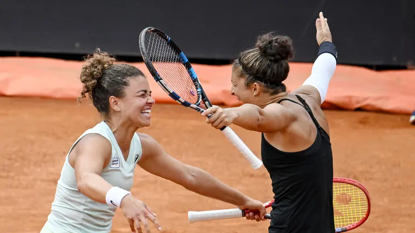 Sara Errani (R) and Jasmine Paolini (L) of Italy, celebtrate after winning the women's double final against Coco Gauff of USA and Erin Routliffe of New Zealand (not pictured) at the Italian Open tennis tournament in Rome, Italy, 19 May 2024. ANSA/ALESSANDRO DI MEO