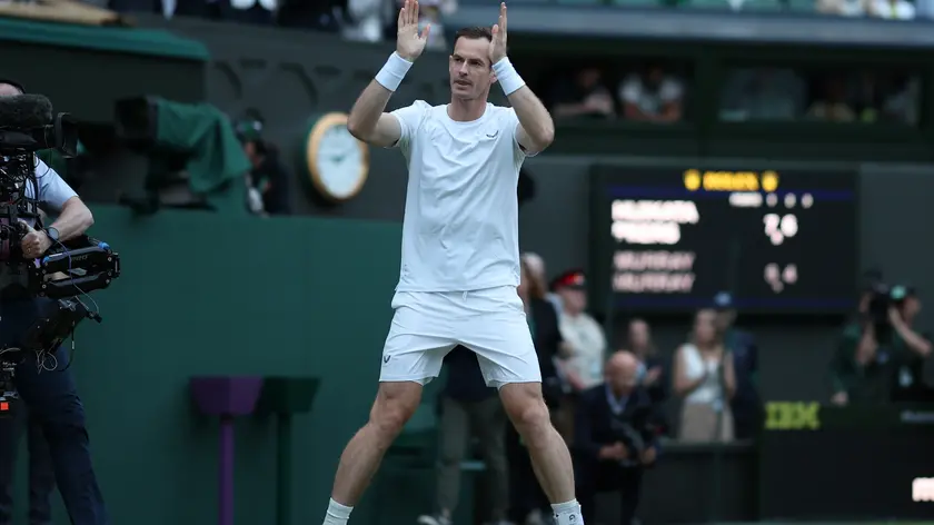 epa11457952 Andy Murray of Britain greets the crowd as he leaves Centre Court following his loss in the Men's doubles 1st round match at the Wimbledon Championships, in Wimbledon, London, Britain, 04 July 2024. EPA/ADAM VAUGHAN EDITORIAL USE ONLY