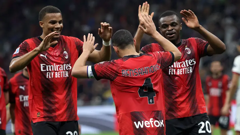 AC Milan’s Ismael Bennacer jubilates with his teammates Malick Thiaw (L) and AC Pierre Kalulu after scoring goal of 1 to 0 during the Italian serie A soccer match between AC Milan and Cagliari at Giuseppe Meazza stadium in Milan, 11 May 2024. ANSA / MATTEO BAZZI