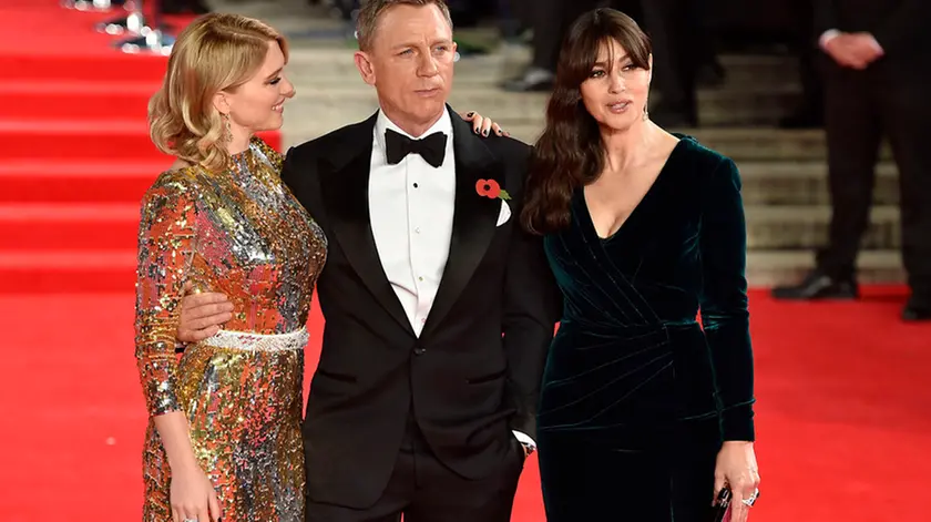 (Left to Right) Lea Seydoux, Daniel Craig and Monica Bellucci attending the World Premiere of Spectre, held at the Royal Albert Hall in London. PRESS ASSOCIATION Photo. Picture date: Monday October 26, 2015. See PA Story: SHOWBIZ Bond. Photo credit should read: Matt Crossick/PA Wire