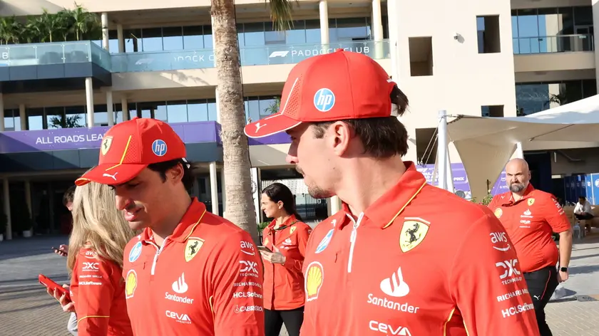 epa11758474 Scuderia Ferrari driver Charles Leclerc (R) of Monaco and his teammate Carlos Sainz Jr. of Spain walk at the paddock ahead of the Formula One Abu Dhabi Grand Prix, in Abu Dhabi, United Arab Emirates, 05 December 2024. The 2024 Formula One Abu Dhabi Grand Prix will be held on the Yas Marina Circuit racetrack on 08 December. EPA/ALI HAIDER