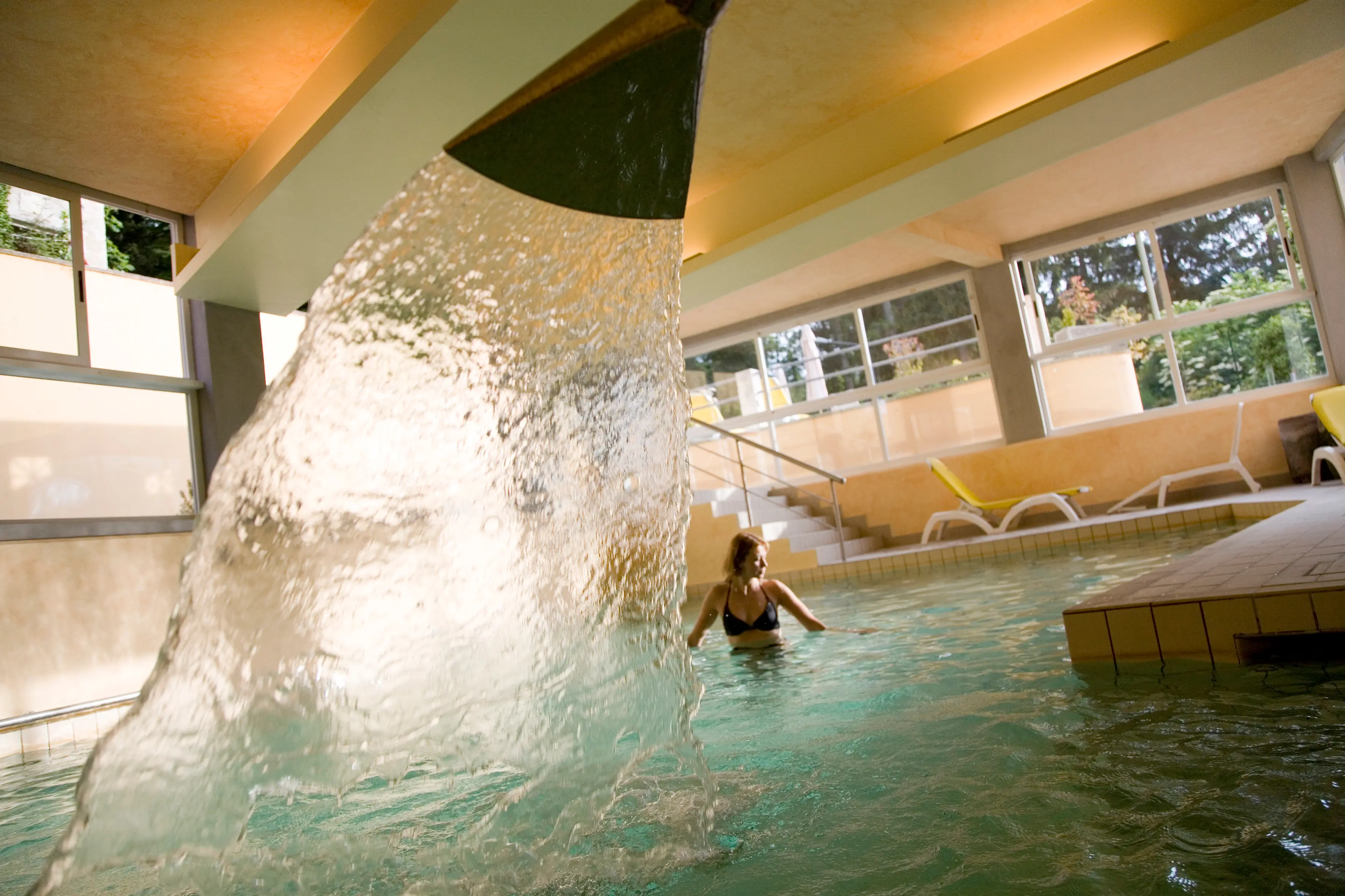 Woman at spa relaxing in pool