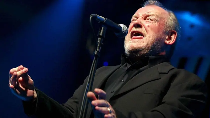 FILE - In this July 20, 2002 file photo, British Rock and Blues legend Joe Cocker performs on stage of the Stravinski hall during the Montreux Jazz Festival, in Montreux, Switzerland. Cocker, best known for the songs, "You Are So Beautiful," and the 1980s duet "Up Where We Belong," with Jennifer Warnes, died Monday, Dec. 22, 2014 of lung cancer in Colorado. He was 70. (AP Photo/Keystone, Fabrice Coffrini, File)