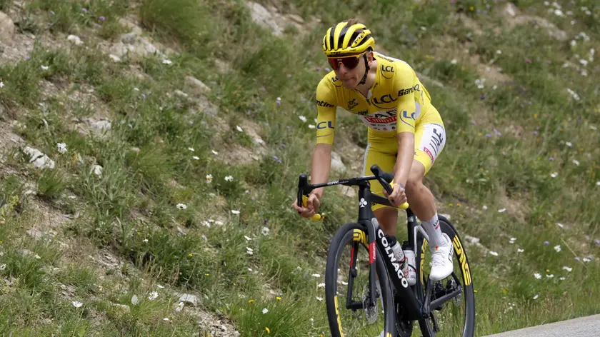 epa11487303 Yellow jersey Slovenian rider Tadej Pogacar of UAE Team Emirates in action during the 19th stage of the 2024 Tour de France cycling race over 144km from Embrun to Isola 2000, France, 19 July 2024. EPA/SEBASTIEN NOGIER