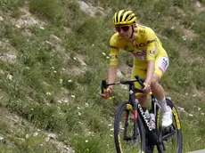 epa11487303 Yellow jersey Slovenian rider Tadej Pogacar of UAE Team Emirates in action during the 19th stage of the 2024 Tour de France cycling race over 144km from Embrun to Isola 2000, France, 19 July 2024. EPA/SEBASTIEN NOGIER