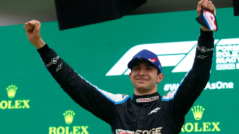 Race winner, Alpine driver Esteban Ocon of France celebrates on the podium after the Hungarian Formula One Grand Prix, at the Hungaroring racetrack in Mogyorod, Hungary, Sunday, Aug. 1, 2021. (Florion Goga/Pool via AP)