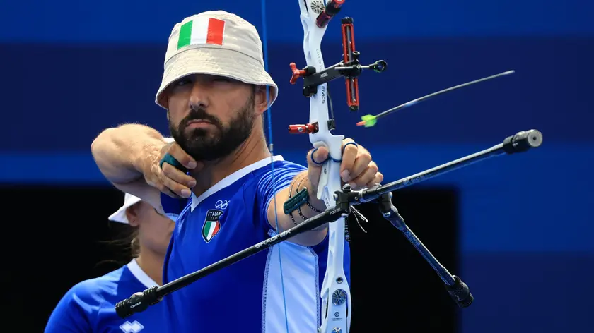 epa11518795 Mauro Nespoli of Italy competes during the Mixed Team Quarterfinals match South Korea vs Italy of the Archery competitions in the Paris 2024 Olympic Games, at the Invalides in Paris, France, 02 August 2024. EPA/MARTIN DIVISEK