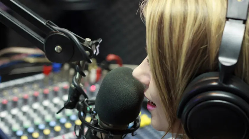 Beautiful Woman Working As Radio DJ Live In Studio