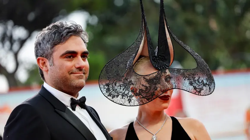 US singer and actor Lady Gaga with her fiancé Michael Polansky arrive at the premiere of ‘Joker: Folie a Deux’ at the 81st annual Venice International Film Festival, in Venice, Italy, 04 September 2024. The movie is presented in the official competition 'Venezia 81' at the festival running from 28 August to 07 September 2024. ANSA/FABIO FRUSTACI