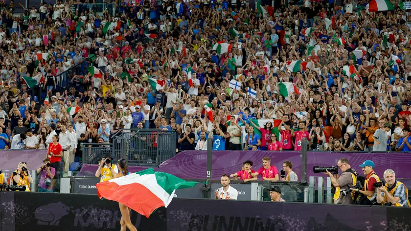 Gold medallist, Nadia Battocletti of Team Italy, celebrates as they cross the finish line to win in the Women's 10,000m Final during the European Athletics Championship at Olimpico Stadium in Rome, Italy, 11 June 2024. ANSA/FABIO FRUSTACI