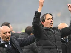 Inter's coach Simone Inzaghi (R) and CEO Giuseppe Marotta celebrate at the end of the Italian Serie A soccer match between Ac Milan and Inter Milan at the Giuseppe Meazza stadium in Milan, Italy, 22 April 2024. ANSA/DANIEL DAL ZENNARO
