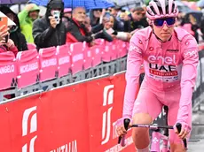 Slovenian rider Tadej Pogacar of team Uae Emirates wearing the overall leader's pink jersey, on the signing in podium ahead the departure of the 20th stage of the 107 Giro d'Italia 2024, cycling race over 184 km from Alpago to Bassano del Grappa, Italy, 25 May 2024. ANSA/LUCA ZENNARO