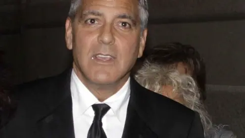 George Clooney and his fiancee Amal Alamuddin arrive for the "Celebrity Fight Night" foundation gala dinner, in Florence, Italy, Sunday, Sept. 7, 2014. (AP Photo/Francesco Bellini)
