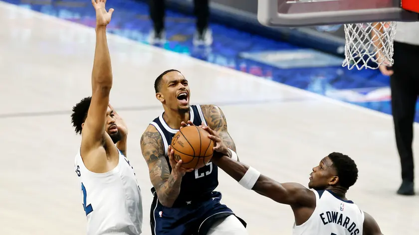 epa11376602 Dallas Mavericks forward P.J. Washington (C) takes a shot in between Minnesota Timberwolves center Karl-Anthony Towns (L) and Minnesota Timberwolves guard Anthony Edwards (R) during the first half of the NBA Western Conference Finals playoff game four between the Minnesota Timberwolves and the Dallas Mavericks in Dallas, Texas, USA, 28 May 2024. EPA/ADAM DAVIS SHUTTERSTOCK OUT