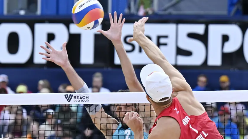 epa11464662 Norway's Anders Mol, right, in action against Italy's Paolo Nicolai during the bronze medal game at the Elite 16 Beach Pro Tour match, in Gstaad, Switzerland, 07 July 2024. EPA/PETER SCHNEIDER