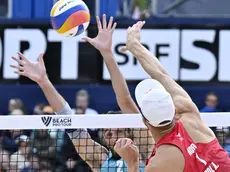 epa11464662 Norway's Anders Mol, right, in action against Italy's Paolo Nicolai during the bronze medal game at the Elite 16 Beach Pro Tour match, in Gstaad, Switzerland, 07 July 2024. EPA/PETER SCHNEIDER