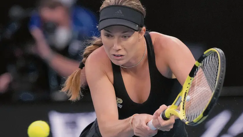 Danielle Collins of the U.S. plays a backhand return to Ash Barty of Australia during the women's singles final at the Australian Open tennis championships in Melbourne, Australia, Saturday, Jan. 29, 2022. (AP Photo/Simon Baker)